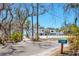 Modern coastal home with clean lines and bright white facade, steps to the beach, and a charming mailbox at 7475 Manasota Key Rd, Englewood, FL 34223