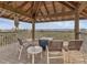 Gazebo featuring outdoor seating, with views of the surrounding landscape and nearby body of water at 7475 Manasota Key Rd, Englewood, FL 34223