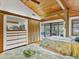Serene main bedroom with vaulted wood ceilings and sliding glass doors to a private balcony at 7475 Manasota Key Rd, Englewood, FL 34223
