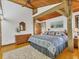 Comfortable bedroom with wooden ceiling, king bed, dresser, beach decor, and relaxing atmosphere at 7475 Manasota Key Rd, Englewood, FL 34223