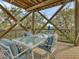 Charming outdoor patio with comfortable seating and a beautiful view of the surrounding landscape at 7475 Manasota Key Rd, Englewood, FL 34223