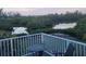 Cozy outdoor space with table and chairs, perfect for enjoying the peaceful water views and surrounding nature at 900 Oxford Dr, Englewood, FL 34223