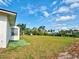 Large back yard featuring a partial view of the side of the home at 914 E 2Nd St, Englewood, FL 34223