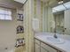 Bathroom featuring a shower with a penguin-themed curtain and patterned wallpaper at 914 E 2Nd St, Englewood, FL 34223