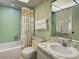 Bathroom with a tub/shower combo, toilet, vanity and sink at 914 E 2Nd St, Englewood, FL 34223