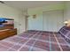 Comfortable bedroom featuring a bed, closet, and soft natural light for a peaceful retreat at 914 E 2Nd St, Englewood, FL 34223