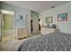 Bedroom featuring a bed, carpet, dressers and ensuite bathroom at 914 E 2Nd St, Englewood, FL 34223