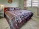 Inviting bedroom with a plush bed, soft lighting, and neutral decor for relaxation at 914 E 2Nd St, Englewood, FL 34223
