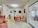 Dining room with a table set for four, chandelier lighting, and vintage details at 914 E 2Nd St, Englewood, FL 34223