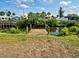 Dock on the canal view featuring houses and lush vegetation at 914 E 2Nd St, Englewood, FL 34223