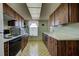 Efficient kitchen layout featuring wood cabinetry and essential appliances for cooking at 914 E 2Nd St, Englewood, FL 34223