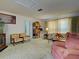 Inviting living room with carpet, large front window, and comfortable furnishings at 914 E 2Nd St, Englewood, FL 34223