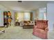 Cozy living room featuring a comfortable sofa, patterned area rug, and bright natural light at 914 E 2Nd St, Englewood, FL 34223