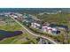 Aerial view of condo complex with beautiful landscaping, lakes, and community amenities at 10045 Links Ln # 203, Rotonda West, FL 33947
