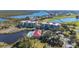 Aerial view of condos next to the lake, a community pool and golf course at 10045 Links Ln # 203, Rotonda West, FL 33947