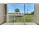 Serene balcony view overlooking a lush golf course, pond, and scenic landscape at 10045 Links Ln # 203, Rotonda West, FL 33947