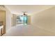 Spacious living area with access to balcony and kitchenette featuring ample natural light at 10045 Links Ln # 203, Rotonda West, FL 33947