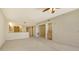Spacious living room with wet bar open to the kitchen in a well-lit interior at 10045 Links Ln # 203, Rotonda West, FL 33947
