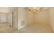 Open living space with a ceiling fan, neutral carpet, and tiled walkway to entry at 10045 Links Ln # 203, Rotonda West, FL 33947