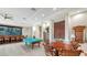 Recreation room with billiard table, bar area, and comfortable seating at 10045 Links Ln # 203, Rotonda West, FL 33947