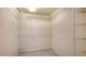 Spacious walk-in closet with white shelving and ample storage space at 10045 Links Ln # 203, Rotonda West, FL 33947