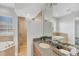 Bathroom features large soaking tub, glass enclosed shower and spacious granite countertop vanity at 10360 Longshore Rd # 66, Placida, FL 33946