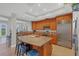Spacious kitchen featuring stainless steel appliances and a central island with seating at 10360 Longshore Rd # 66, Placida, FL 33946