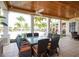 Outdoor dining with a table for eight, perfect for entertaining near the pool and other community activities at 10360 Longshore Rd # 66, Placida, FL 33946