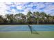 Well-maintained tennis court with green and blue surfaces, ready for a friendly match at 10360 Longshore Rd # 66, Placida, FL 33946