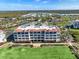 Overhead angle of condo buildings surrounded by lush tropical landscaping and beautiful grounds at 11200 Hacienda Del Mar Blvd # 201, Placida, FL 33946