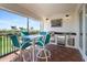 Outdoor dining on the lanai with outdoor kitchen/bar area and beautiful golf course views at 11200 Hacienda Del Mar Blvd # 201, Placida, FL 33946