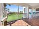 Enjoy the view from this lanai with tile floors, patio furniture, and a lovely view of the green lawn at 11200 Hacienda Del Mar Blvd # 201, Placida, FL 33946
