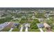 Aerial view of a neighborhood showcasing houses with spacious lots and mature trees at 215 Australian Dr, Rotonda West, FL 33947