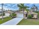 Inviting single-story home with a well-manicured lawn, dual garage, and charming landscaping at 215 Australian Dr, Rotonda West, FL 33947