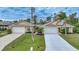 Charming single-story home featuring a two-car garage and meticulously landscaped front yard at 215 Australian Dr, Rotonda West, FL 33947