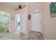 Welcoming foyer with tile flooring, closet, and easy access to other rooms at 215 Australian Dr, Rotonda West, FL 33947