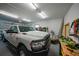 Clean and organized garage with overhead lighting and space for storage and vehicle parking at 215 Australian Dr, Rotonda West, FL 33947