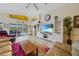 Spacious living room showcasing views of the screened-in pool, with a stylish decor at 215 Australian Dr, Rotonda West, FL 33947
