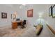 Cozy home office with a desk, chair, and comfortable couch for relaxing at 215 Australian Dr, Rotonda West, FL 33947