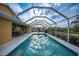 A screened-in pool offers an ideal space for outdoor enjoyment, along with a nearby dining area at 215 Australian Dr, Rotonda West, FL 33947
