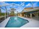 Inviting screened-in pool area, perfect for entertaining and relaxing outdoors at 215 Australian Dr, Rotonda West, FL 33947