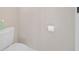 Close-up of the toilet with the toilet paper roll on a clean wall at 215 Australian Dr, Rotonda West, FL 33947