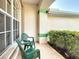 Inviting porch area with tiled flooring and lush garden view creating an ideal spot for outdoor enjoyment at 252 Medalist Rd, Rotonda West, FL 33947