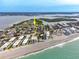 Stunning aerial view of the home, ocean, surrounding neighborhood, and waterfront access at 2805 N Beach Rd # B, Englewood, FL 34223