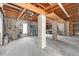 Large basement featuring exposed ceiling with structural beams and concrete pillars, great for storage at 2805 N Beach Rd # B, Englewood, FL 34223