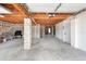 Spacious unfinished basement with block construction and exposed wood joists, perfect for customization at 2805 N Beach Rd # B, Englewood, FL 34223
