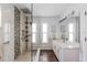 Modern bathroom featuring a spacious glass shower, vanity, and neutral tile finishes at 2805 N Beach Rd # B, Englewood, FL 34223