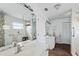 Bright bathroom with double sink vanity, modern fixtures, and walk-in shower at 2805 N Beach Rd # B, Englewood, FL 34223