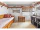 Well-lit bedroom with light carpet, wooden bed frame, lots of decor and a desk at 2805 N Beach Rd # B, Englewood, FL 34223