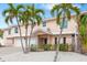 Inviting home exterior with a two-car garage, a covered entry, and attractive landscaping at 2805 N Beach Rd # B, Englewood, FL 34223
